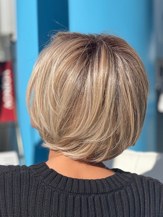 Roxie wearing STRAIGHT UP WITH A TWIST By RAQUEL WELCH in RL19/23SS SHADED BISCUIT | Cool Platinum blonde with subtle highlights and medium brown roots