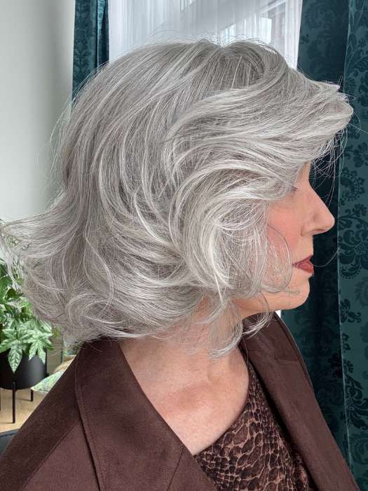 Mel B. @mels.be.ageless wearing CROWD PLEASER by RAQUEL WELCH WIGS in color RL56/60 SILVER MIST | Lightest Gray Evenly Blended with Pure White
